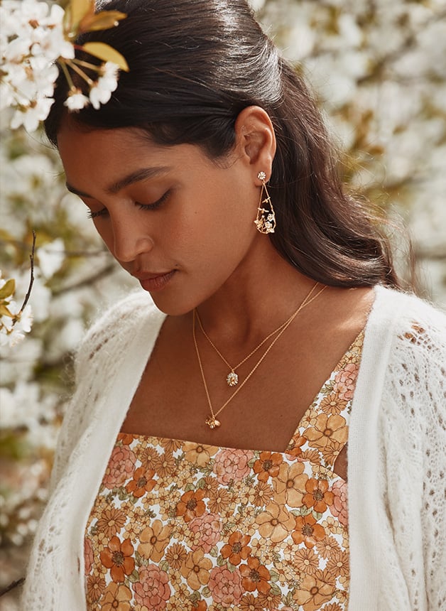 Model wearing Strawberry Patch Teardrop Earrings with Buzzing Bees Alex Monroe Jewellery