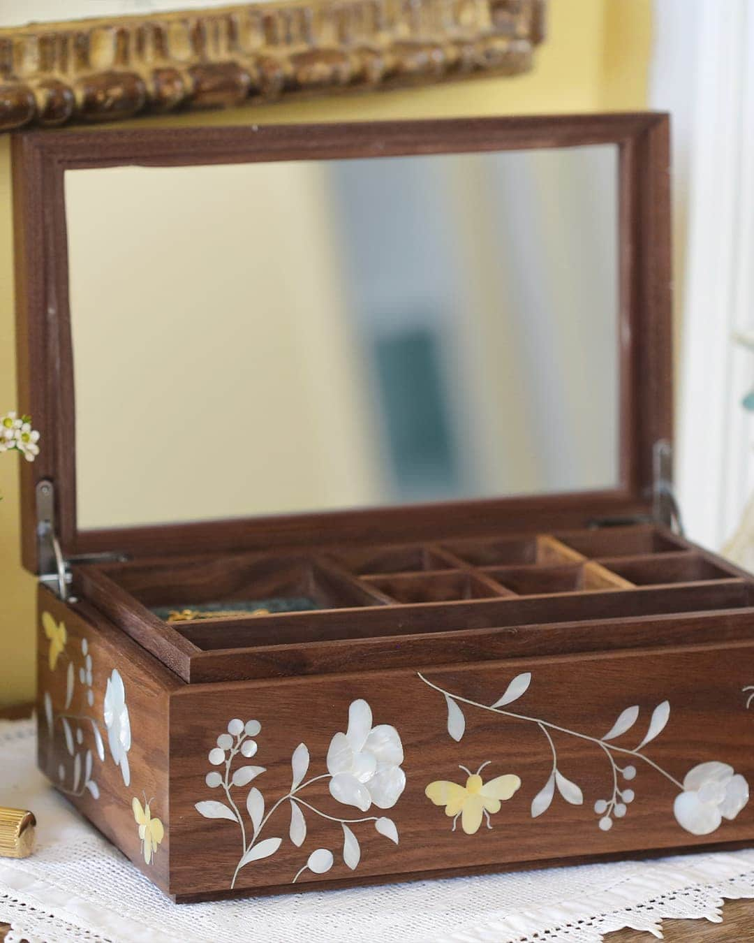 Bees in Bloom Heirloom Jewellery Box open and displaying mirror on sideboard with candlestick, flowers and makeup.