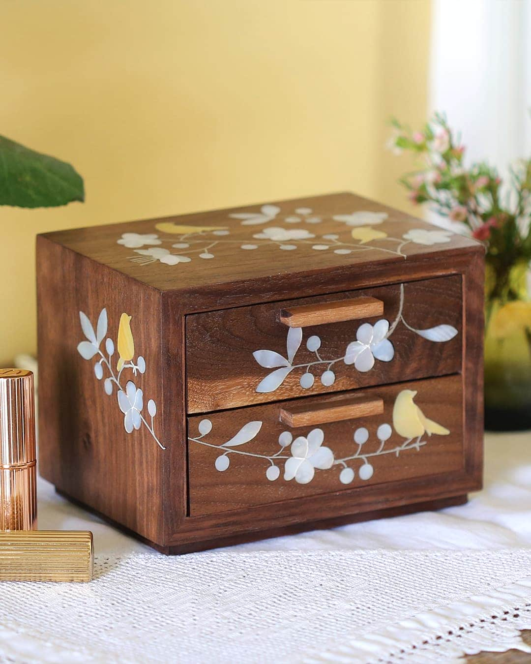 Bees in Bloom Heirloom Jewellery Box on sideboard with candlestick, flowers and makeup.